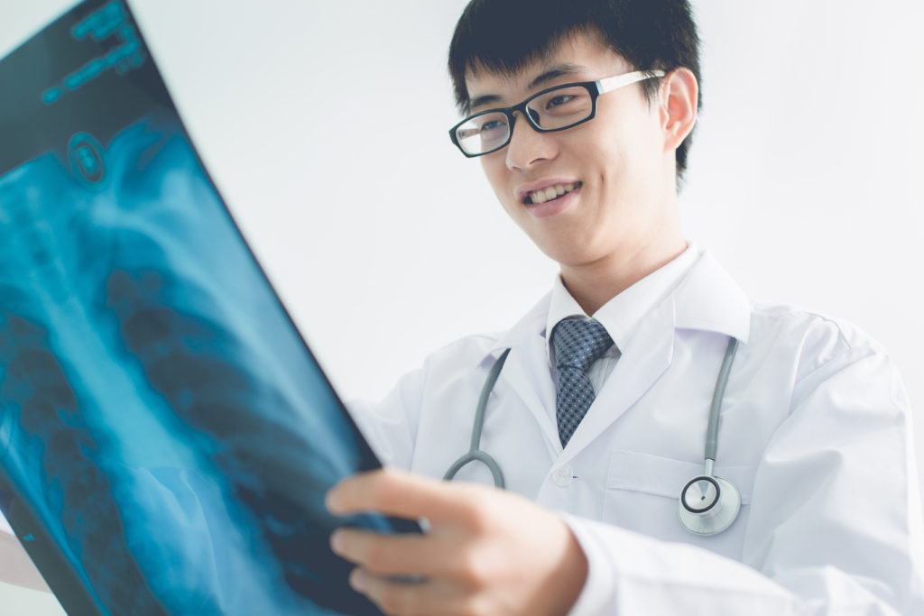 Doctor examining an X-ray image.